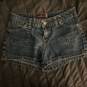 medium wash vintage denim shorts. no back pockets.